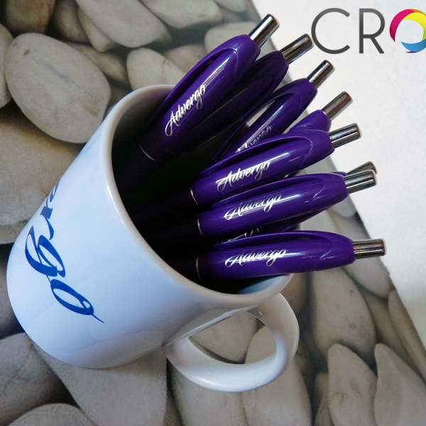 Glasses and pens with a logo