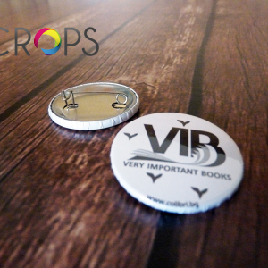 Round badges with a safe needle